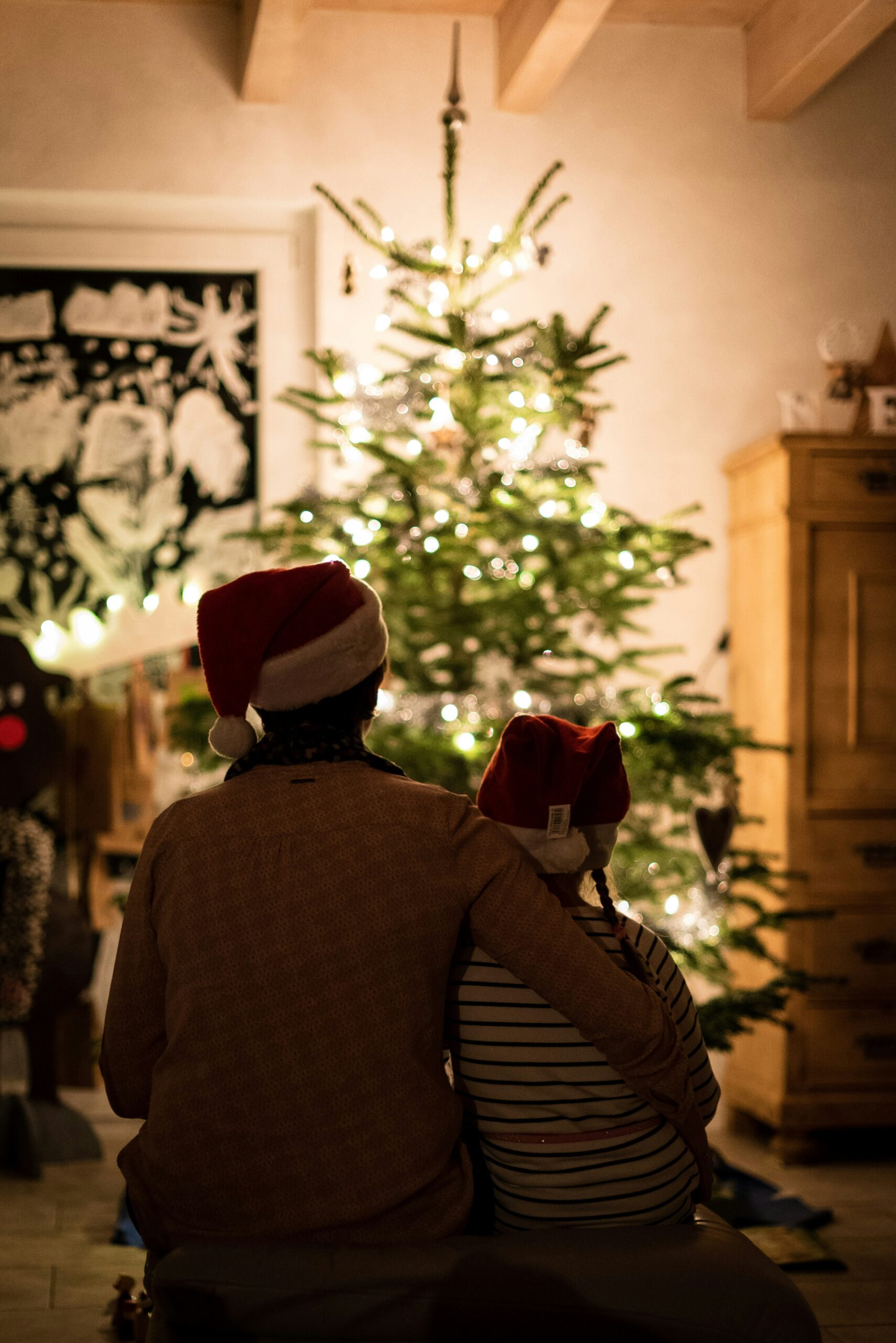 family watching christmas tree lit up